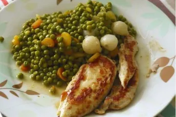 Chicken breast with peas and onions.