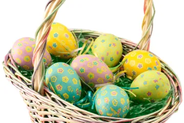 A basket with decorated Easter eggs.