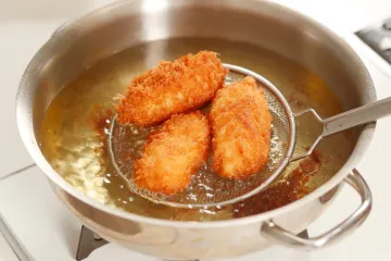 Depp frying croquettes in cooking oil