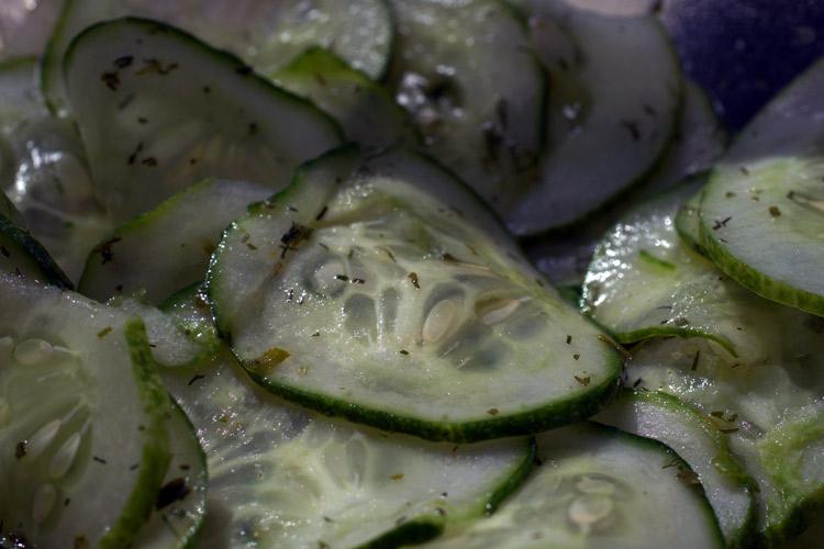 Detail of vinegared cucumber slices.