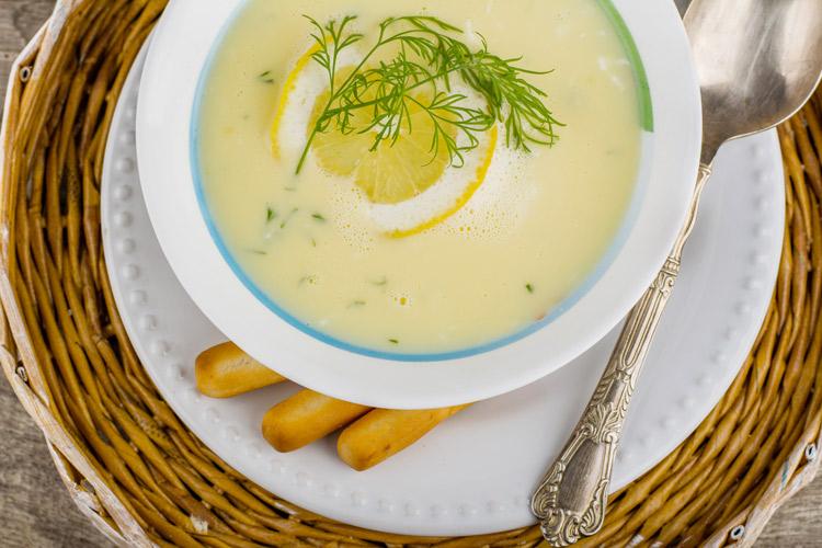 Avgolemono soup in a bowl.