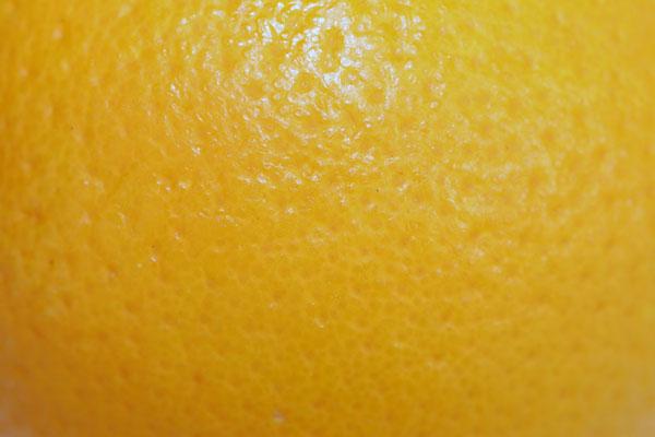 Close up of the skin of an orange.