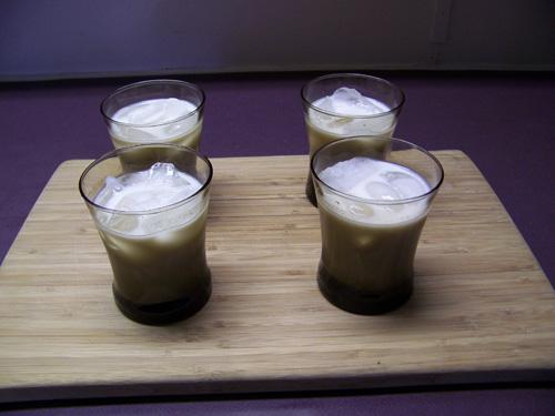 Four glasses with rum horchata.