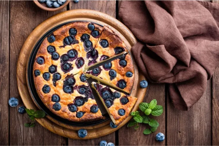 Blueberry cake on a serving plate.