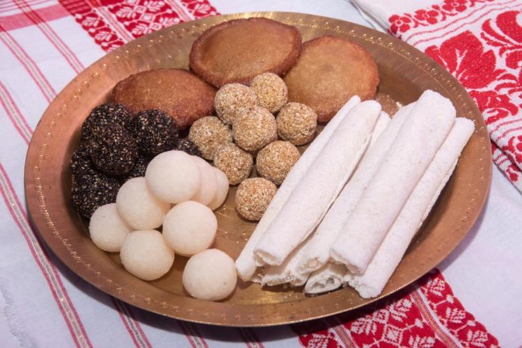 A plate wit a variety of Bihu Festival food.