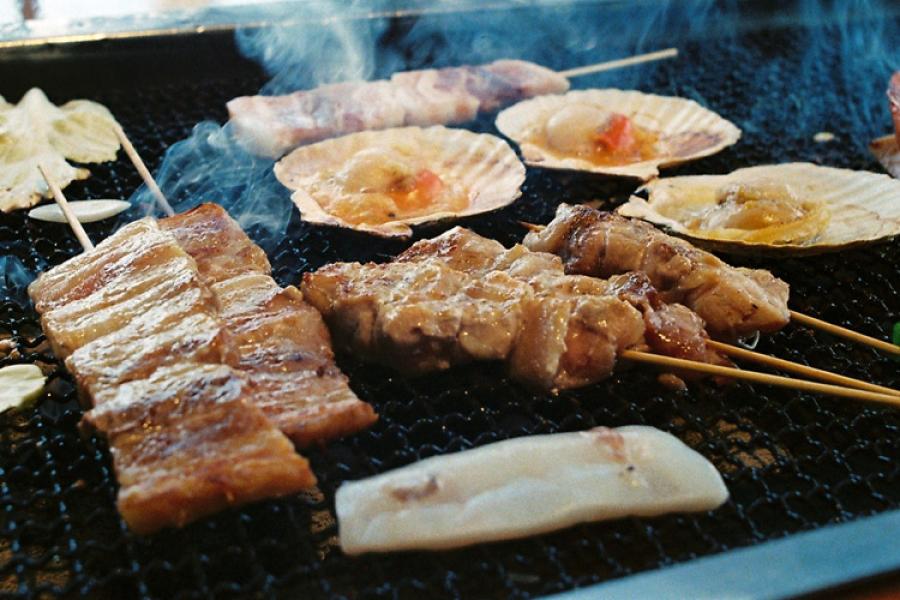 Cooking a barbecue.