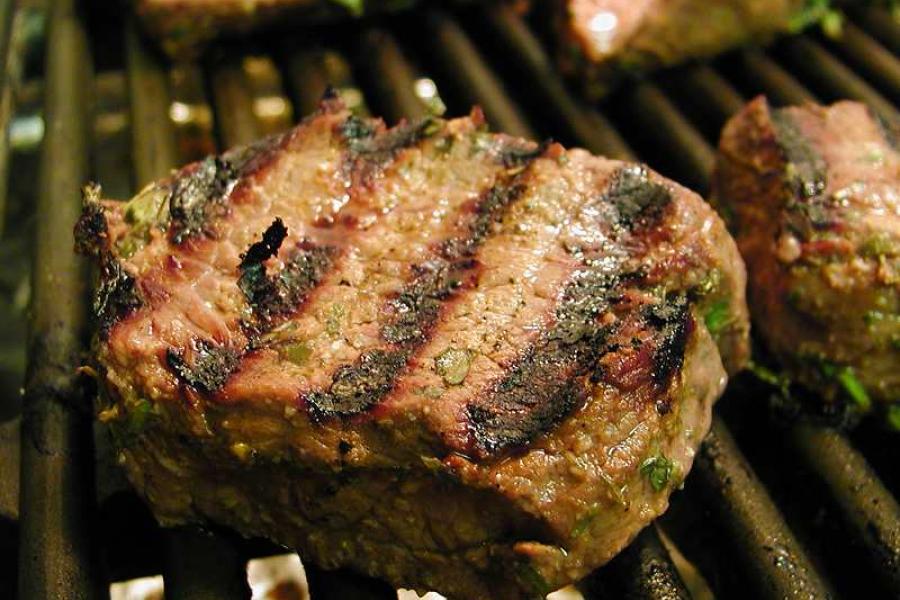 Marinated fillet steak on the grill.