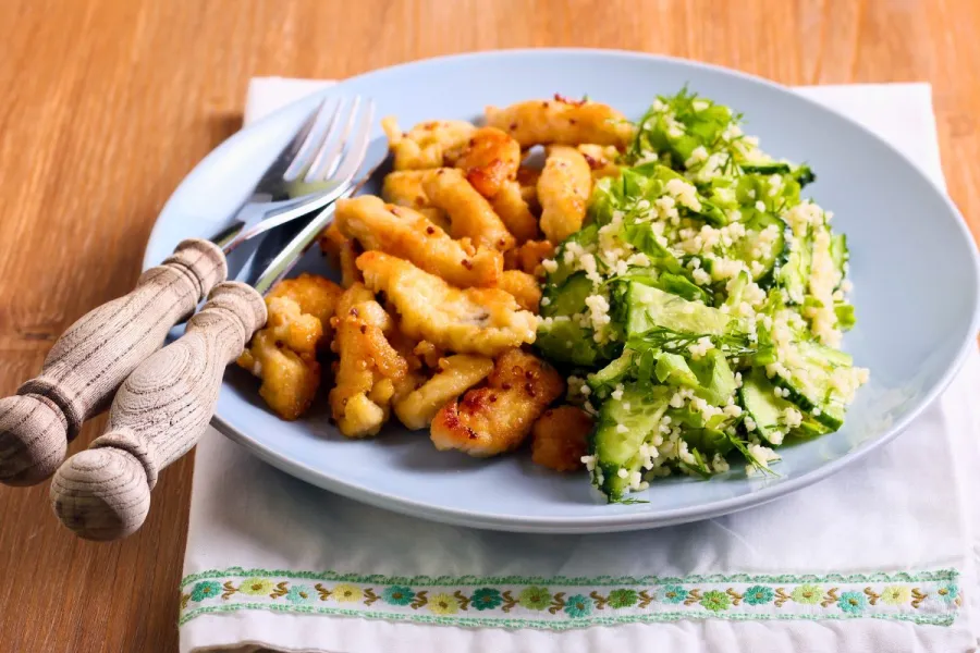 Honey mustard glazed chicken with vegetable couscous on the side.